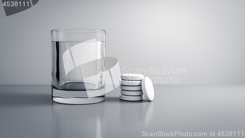 Image of glass of water with some tablets