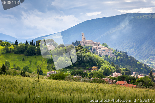 Image of Camerino in Italy Marche over colourful fields