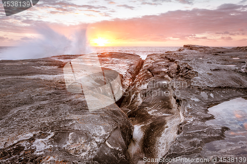 Image of Waves splash up onto rocks on coast of Sydney