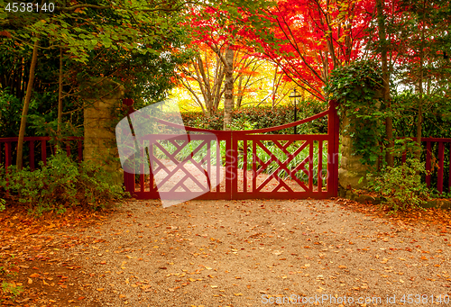 Image of Red gate and autumn colours of beautiful gardens