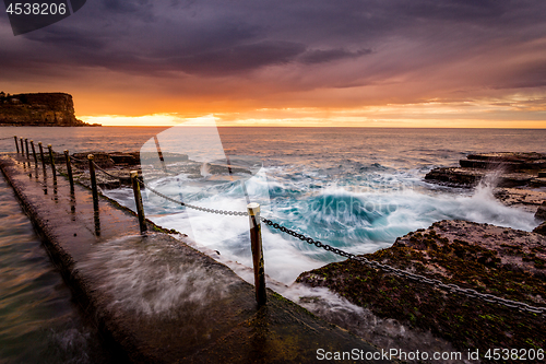 Image of Coastal sunrise by ocean pool