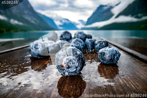 Image of Blueberry antioxidants on a wooden table on a background of Norw