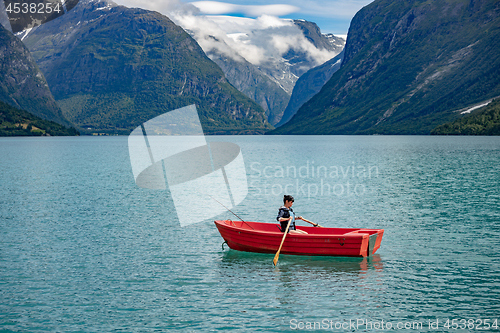 Image of Woman fishing on a boat.