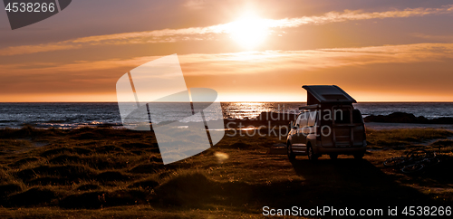 Image of Camping car minivan on the beach at sunset Lofoten beach.