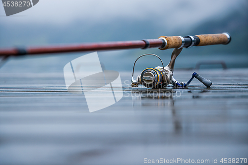 Image of Fishing rod spinning blurred background