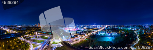 Image of Night Aerial view panorama of a freeway intersection traffic tra