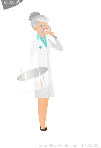 Image of Caucasian dentist examining teeth with a magnifier