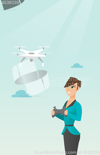 Image of Young caucasian woman flying drone.