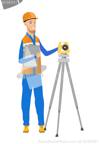 Image of Caucasian surveyor builder working with theodolite