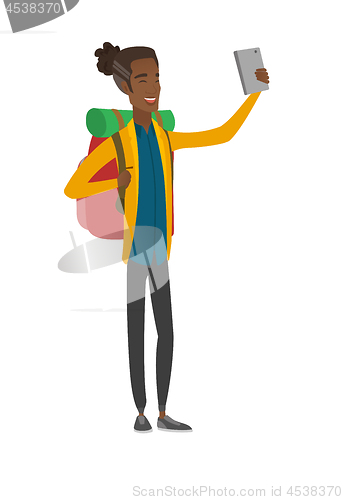 Image of Young african traveler with backpack making selfie