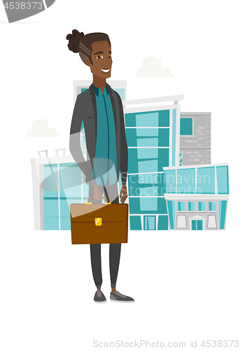 Image of Young african businessman holding briefcase.