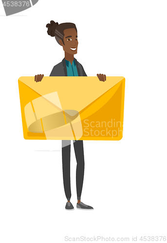 Image of Young african-american man holding a big envelope.
