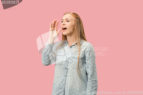 Image of Isolated on pink young casual woman shouting at studio