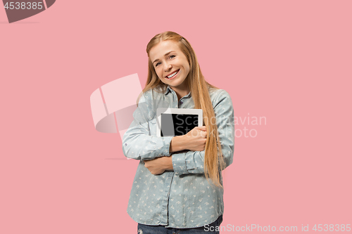 Image of The happy businesswoman with red laptop on pink