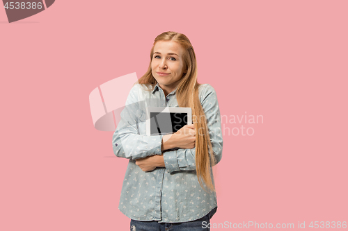 Image of The happy businesswoman with red laptop on pink