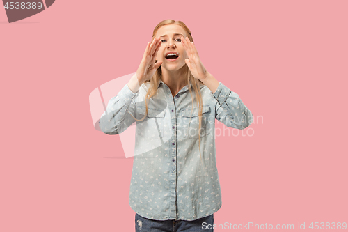 Image of Isolated on pink young casual woman shouting at studio