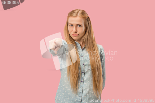 Image of The overbearing business woman point you and want you, half length closeup portrait on pink background.