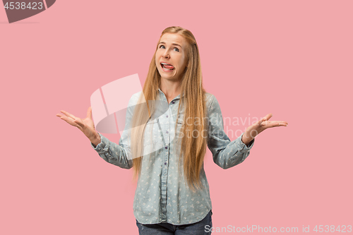 Image of The squint eyed woman with weird expression isolated on pink