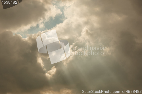 Image of the clouds in the sky and the rays of the sun.