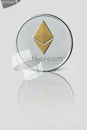 Image of Ethereum coin isolated on glossy white background