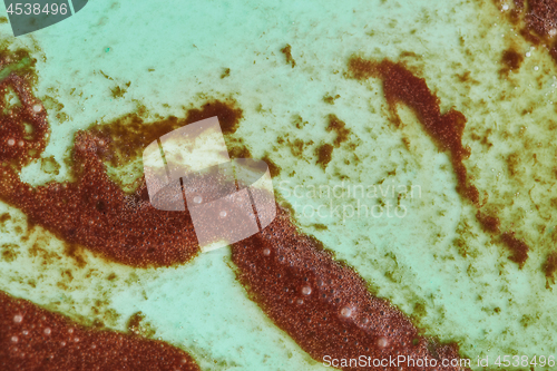 Image of Decorative background from melted ice cream in a green and brown