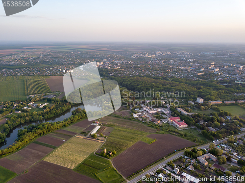 Image of Aerial panoramic view from the drone to the national dendrological park Sofiyivka and the city of Uman, Ukraine in the summer at sunset