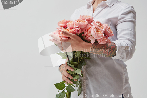 Image of Girl with bouquet of flowers