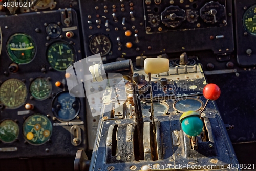 Image of Center console and throttles in an old airplane
