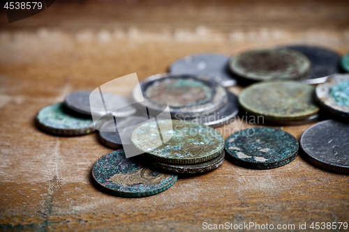 Image of Pile of different ancient copper coins with patina.