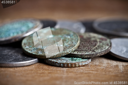 Image of Pile of different ancient copper coins with patina.