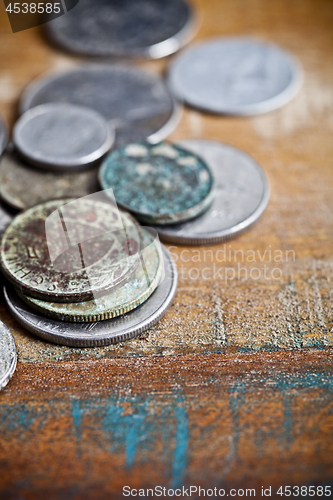 Image of Pile of different ancient copper coins with patina.