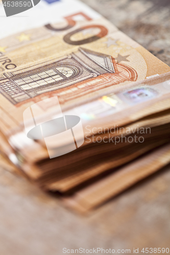 Image of Pile of fifty euro banknotes.