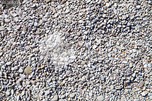 Image of Abstract background with grey and white peable stones.