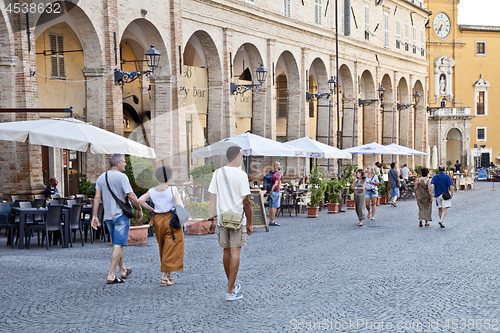 Image of Fermo, Italy - June 23, 2019: People enjoying summer day and foo