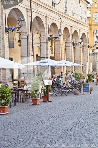 Image of Fermo, Italy - June 23, 2019: People enjoying summer day and foo