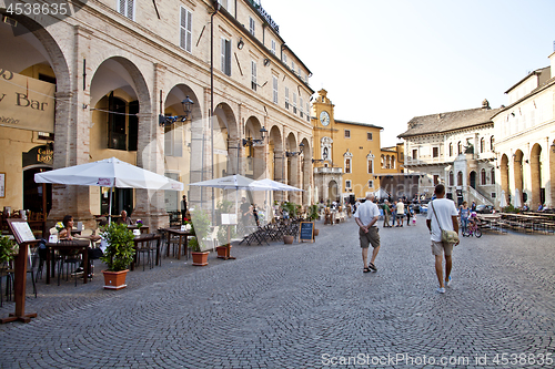 Image of Fermo, Italy - June 23, 2019: People enjoying summer day and foo