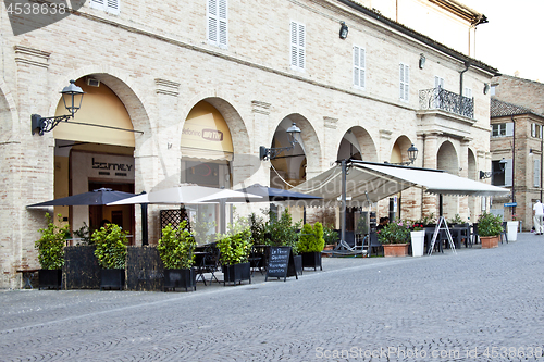 Image of Fermo, Italy - June 23, 2019: Summer day and utdoor restaurant.