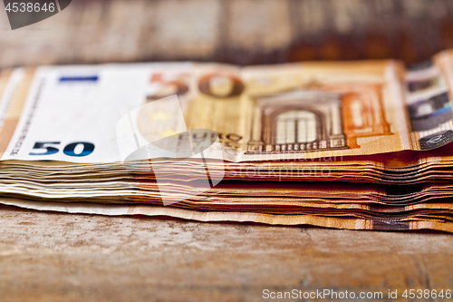 Image of Pile of fifty euro banknotes. 