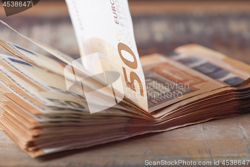 Image of Pile of fifty euro banknotes.