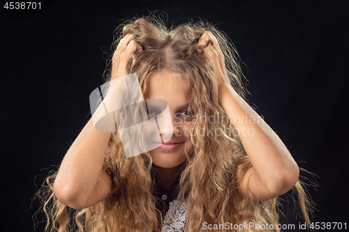 Image of Ten-year-old girl shakes hands with long blond hair