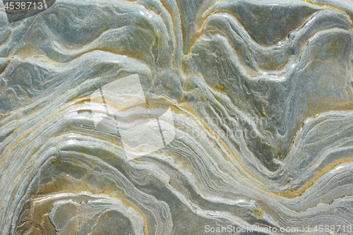 Image of Texture - wet sea stone, with stains reminiscent of a wave