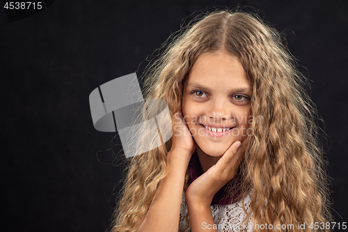 Image of Closeup portrait of a cheerful ten year old girl who looks left