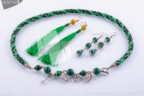 Image of Necklace and two sets of earrings made of small beads and handmade stones