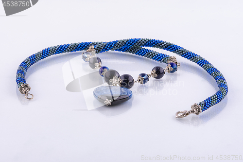 Image of Handmade designer necklace in blue tones of beads and natural stones