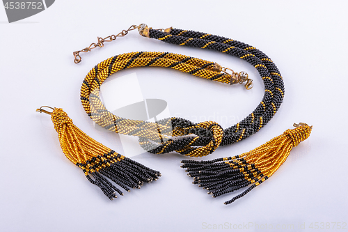 Image of Handmade necklace and earrings set from small black and gold beads