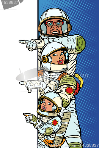 Image of multi race family astronauts mom dad and son. Point to copy space poster