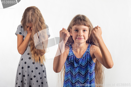 Image of Girl rejoices that offended another girl