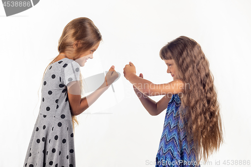 Image of Two girls are fighting, studio white background