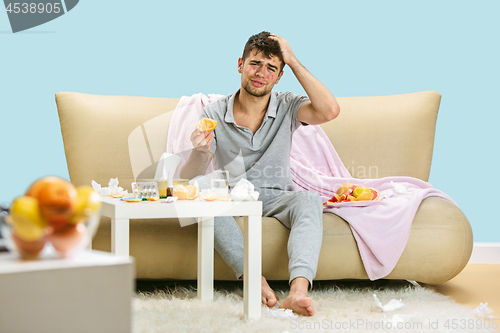 Image of Young man suffering from allergy to citrus fruits