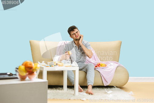 Image of Young man suffering from allergy to citrus fruits